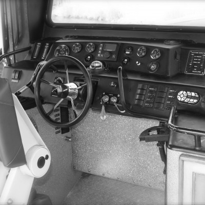the interior of a boat front controls